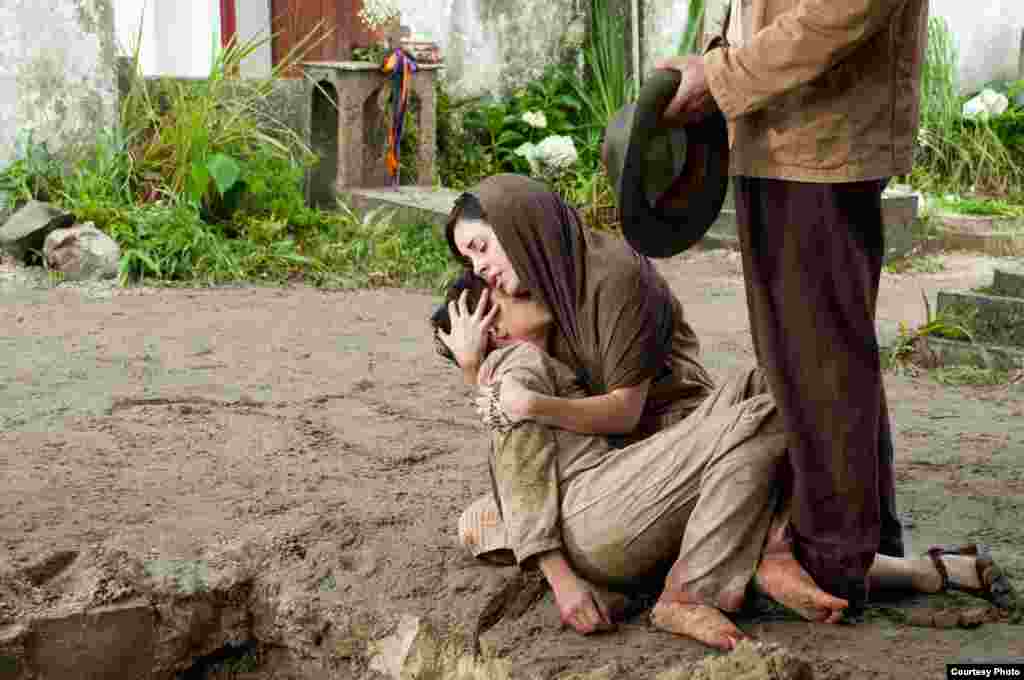Karyme Lozano (right) holds Mauricio Kuri (left) in FOR GREATER GLORY, courtesy of ARC Entertainment. (Photo: Hana Matsumoto)