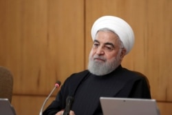 In this photo released by the official website of the Office of the Iranian Presidency, President Hassan Rouhani speaks during a Cabinet meeting in Tehran, Jan. 15, 2020.