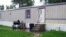 This photo taken July 17, 2015, shows a mobile home that prosecutors say Guatemalan teenagers were forced to live in when they weren’t working at egg farms in Marion, Ohio. 
