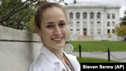 In this Thursday, Oct. 17, 2019 photo Harvard Medical School student Aliya Feroe poses for a photograph on the school's campus, in Boston. 