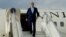 FILE - US Secretary of State John Kerry leaves his aircraft.