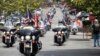 FILE - Patriot Guard Riders escort a motorcade carrying 200 POWs for the 40th anniversary of the homecoming of Vietnam POWs at Richard Nixon Presidential Library and Museum in Yorba Linda, California, May 23, 2013.