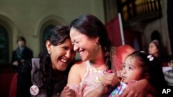 Aura Hernandez, seen here in a New York church, is one of 42 people trying to avoid deportation by living in sanctuary in 28 U.S. cities.  