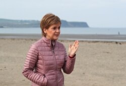 Scottish First Minister and leader of the Scottish National Party (SNP) Nicola Sturgeon speaks as she campaigns for the parliamentary elections, in Ayr, April 19, 2021.