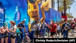 People wait in line for the Pikachu experience on Day One at Comic-Con International on Thursday, July 18, 2019, in San Diego, Calif. (Christy Radecic/Invision/AP)