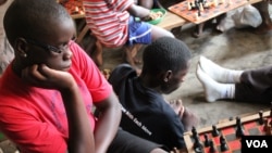 Phiona Mutesi considers a move at the Sports Outreach ministry in Kampala, Uganda, January 28, 2012. (H. Heuler/VOA)