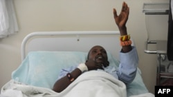 An injured Kenyan policeman lies on a hospital bed in Nairobi on November 11, 2012 recounting how he an others were attacked in Baragoi, Samburu North District.
