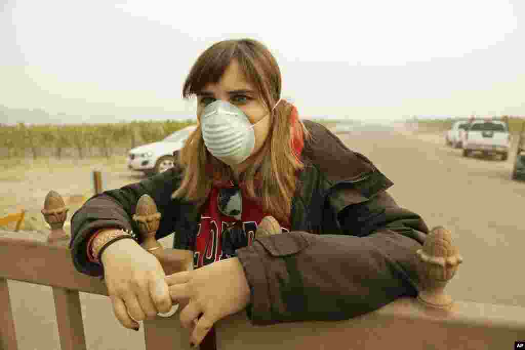 Angela Pardo works at the main entrance gate to the Gundlach Bundschu winery, Oct. 10, 2017, in Sonoma, California. 
