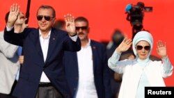 Turkish President Tayyip Erdogan and his wife Emine Gulbaran attend Democracy and Martyrs Rally, organized by him and supported by ruling AK Party (AKP), oppositions Republican People's Party (CHP) and Nationalist Movement Party (MHP), to protest against