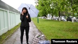 Katerina Borisevich, a journalist for the independent news outlet Tut.by, speaks on the phone after being released from a prison in Gomel, Belarus, May 19, 2021.