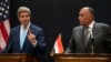 U.S. Secretary of State John Kerry, left, speaks during a joint news conference with Egyptian Foreign Minister Sameh Shoukry following his meeting with Egyptian President Abdel-Fattah el-Sissi in Cairo, Egypt, June 22, 2014.