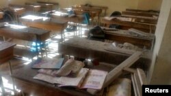 A view shows the damage inside a classroom after shelling by Syrian rebels on government-held western Aleppo, Syria in this handout picture provided by SANA, Nov. 20, 2016. 