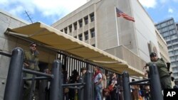FILE - In this March 17, 2003, file photo, an Israeli border policemen guards the U.S. Embassy in Tel Aviv.