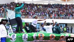 FILE - Incumbent Zambian President Edgar Lungu supporters cheer on May 21, 2016 at the Heroes Stadium in Lusaka during the launching of his re-election campaign ahead of polling day on August 11. 