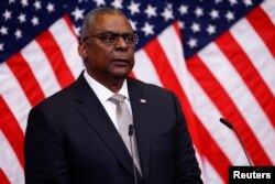 FILE - U.S. Secretary of Defence Lloyd Austin attends a news conference during a NATO Defence Ministers meeting in Brussels, Belgium October 12, 2022. (REUTERS/Yves Herman)