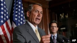 On the day of President Barack Obama’s State of the Union address, House Speaker John Boehner (l) with House Majority Leader Eric Cantor speaks to reporters at the Republican National Committee headquarters in Washington, Jan. 28, 2014.