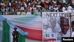 FILE - A soldier stands guard during a launch campaign by the ruling All Progressives Congress (APC) party for President Muhammadu Buhari's re-election bid, in Uyo, Nigeria, Dec. 28, 2018.