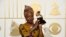 FILE - Angelique Kidjo, seen in this Feb. 15, 2016 photo with award for best world music album for "Sings" at the 58th annual Grammy Awards, has won a human rights award, along with three African youth activist movements, for their work defending freedom of expression and peaceful protest.