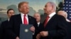 President Trump smiles at Israeli PM Benjamin Netanyahu, right, after signing a proclamation in the Diplomatic Reception Room at the White House in Washington, March 25, 2019. Trump signed an official proclamation formally recognizing Israel's sovereignty over the Golan Heights.