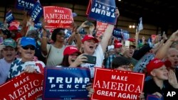 FILE - Supporters of Republican presidential candidate Donald Trump cheer as he arrives to a campaign rally, Sept. 17, 2016, in Colorado Springs, Colo. 