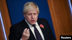 Britain's Prime Minister Boris Johnson speaks during a news conference following the the UN Climate COP26 inside the Downing Street Briefing Room in central London, Britain Nov. 14, 2021. 