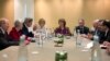 U.S. Secretary of State John Kerry, third left, meets with EU High Representative for Foreign Affairs, Catherine Ashton, center, and Iranian Foreign Minister Mohammad Javad Zarif, third right, at the Iran Nuclear talks in Geneva, Nov. 9, 2013.