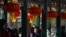 FILE -People rest under decorative lanterns at the Lunar New Year of the Dragon celebration in Beijing on Feb. 13, 2024. A report says the videos promoting Chinese culture are prominent on China's Spanish-language YouTube channels.