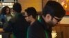Two Starbucks employees work to fill orders at the chain coffee shop in Falls Church, Va. on May 18, 2016. (VOA/Catherine Maddux)