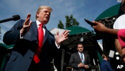 President Donald Trump speaks to reporters at the White House, Friday, June 15, 2018, in Washington. (AP Photo/Evan Vucci)