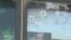 Bullet holes in window of a civilian bus