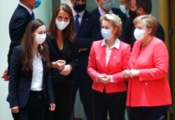 From left, Finland's Prime Minister Sanna Marin, Belgium's Prime Minister Sophie Wilmes, European Commission President Ursula von der Leyen and German Chancellor Angela Merkel during a round table meeting at an EU summit in Brussels, July 17, 2020.