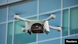 FILE - A UPS drone makes a Flight Forward medical delivery on WakeMed Health & Hospitals' main campus in Raleigh, North Carolina, in an undated photo. 