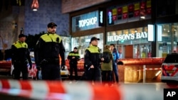 Dutch police secure a shopping street after a stabbing incident in the center of The Hague, Netherlands, Nov. 29, 2019.