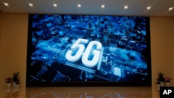 FILE - A 5G logo is displayed at the Huawei campus in Shenzhen city, China, March 6, 2019.
