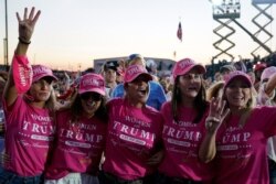Supporters watch as President Donald Trump speaks during a campaign rally at Orlando Sanford International Airport, Oct. 12, 2020, in Sanford, Fla.