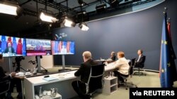 German Chancellor Angela Merkel hosts a video conference with European Council President Charles Michel, European Commission President Ursula von der Leyen and China's President Xi Jinping, at the Chancellery in Berlin, Sept. 14, 2020.