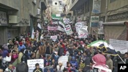 Demonstrators gather during a protest against Syria's President Bashar al-Assad after Friday prayers in Yabroud near Damascus March 2, 2012.