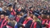 Some of the six thousand Liberty University graduates are seen in the school's football stadium for the university's 44th commencement, in Lynchburg, Virginia, May 13, 2017. (C. Presutti/VOA)