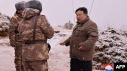 This picture taken on Jan. 28, 2024, and released by North Korea's official Korean Central News Agency on Jan. 29 shows North Korean leader Kim Jong Un inspecting a test-fire of the submarine-launched strategic cruise missile.