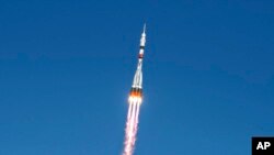 FILE - In this handout photo released by the Russian space agency Roscosmos, the Soyuz MS-17 space ship carrying a new crew to the International Space Station (ISS) blasts off at the Russian-leased Baikonur space facility in Kazakhstan, Oct. 14, 2020.