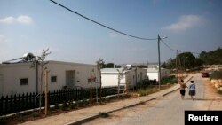 Israeli women walk in a Jewish settlement known as "Gevaot" - in the Etzion settlement bloc - near Bethlehem, Aug. 31, 2014.
