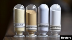 FILE - Samples of rare earth minerals (L-R): Cerium oxide, Bastnasite, Neodymium oxide and Lanthanum carbonate are on display during a tour of Molycorp's Mountain Pass Rare Earth facility in Mountain Pass, California.