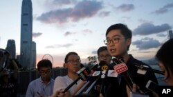 FILE - Politician Andy Chan of the Hong Kong National Party speaks to the media in Hong Kong, July 26, 2016.