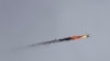 Syrian government helicopter is hit by a missile in Idlib province, Syria, Feb. 11, 2020.