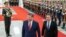 Chinese President Xi Jinping, center, walks with Kyrgyzstan's President Sadyr Japarov during the welcome ceremony at the Great Hall of the People in Beijing, China, Feb. 5, 2025. 