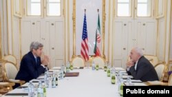 U.S. Secretary of State John Kerry sits across from Iranian Foreign Minister Javad Zarif on June 30, 2015, in Vienna, Austria, before a one-on-one meeting amid negotiations about the future of Iran's nuclear program. (Photo: State Department)