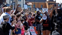 Protesters participate in a Black Lives Matter rally on Mount Washington in Pittsburgh on Sunday, June 7, 2020, to protest the death of George Floyd, who died May 25 after being restrained by police in Minneapolis. (AP Photo/Gene J. Puskar)