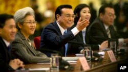 Chinese Prime Minister Li Keqiang answers a reporter's question at the end of the National People's Congress in Beijing. (AP Photo/Mark Schiefelbein)
