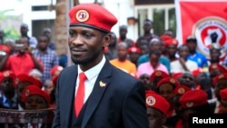 FILE - Ugandan musician turned politician, Robert Kyagulanyi also known as Bobi Wine arrives at the news conference at his home in Kasangati, Kampala, Uganda, July 24, 2019.