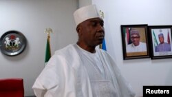 Nigeria's Senate President Bukola Saraki speaks in his office in Abuja, Nigeria, after senators defected from President Muhammadu Buhari's ruling All Progressives Congress, July 24, 2018. 